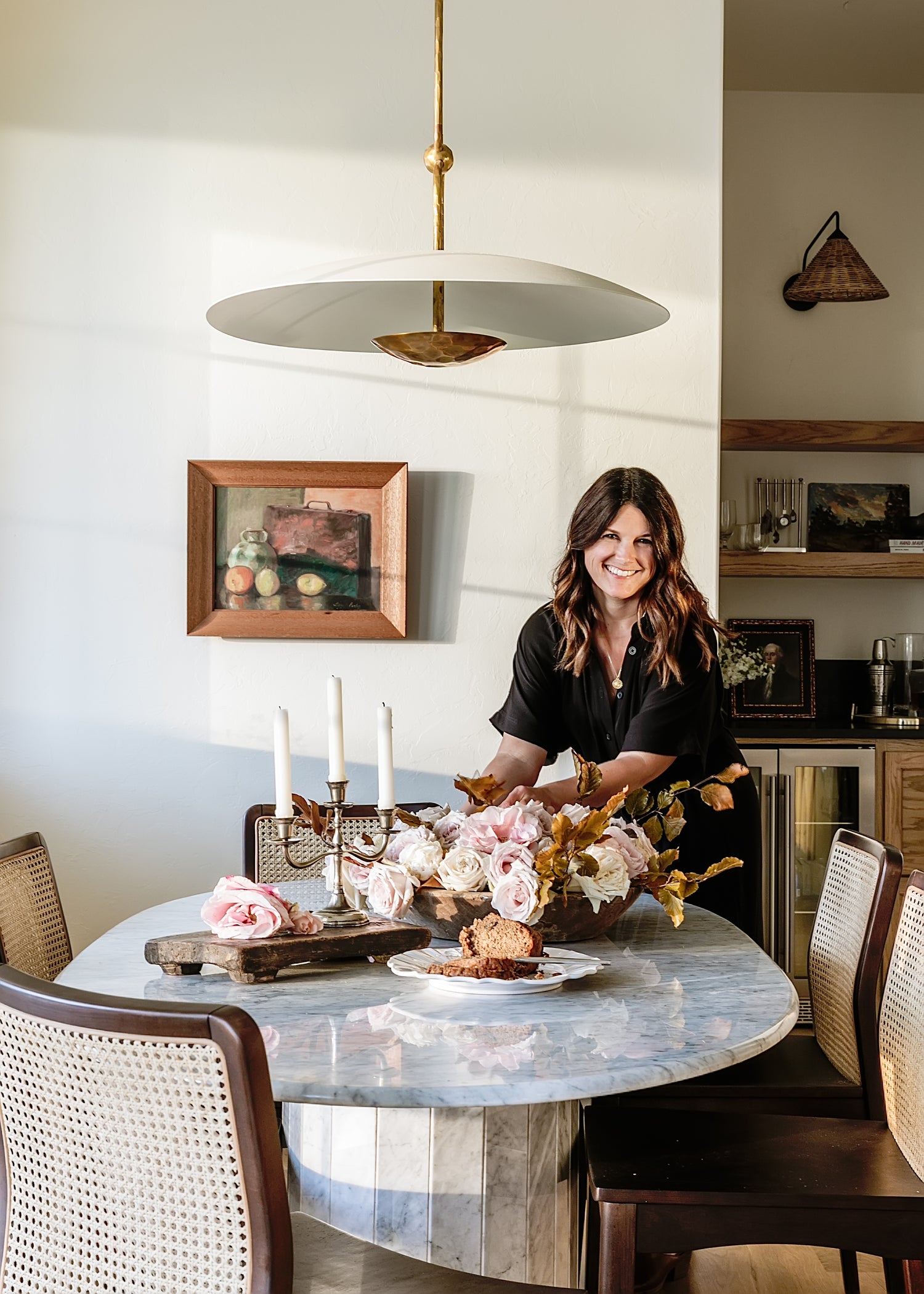 Kelsey Leigh McGregor, founder of Kelsey Leigh Design Co. and Heritage House, styling a floral arrangement. 